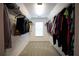 Bright walk-in closet with carpet, wire shelving, and a window bringing in natural light at 93 Richmond Way, Villa Rica, GA 30180