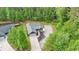 Beautiful aerial view of home surrounded by lush greenery, complemented by a long driveway at 154 Carmen Ln, Dallas, GA 30157