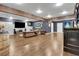 Spacious room with hardwood floors, comfortable furniture, and a unique bar for entertaining guests at 154 Carmen Ln, Dallas, GA 30157