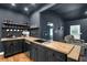 Stylish kitchenette with dark cabinets, butcher block countertops, and open shelving at 154 Carmen Ln, Dallas, GA 30157