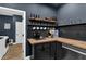 Cozy kitchenette area with dark cabinets, butcher block countertops, and modern appliances at 154 Carmen Ln, Dallas, GA 30157