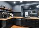 Modern kitchenette with dark cabinetry, butcher block countertops, and stainless steel appliances at 154 Carmen Ln, Dallas, GA 30157