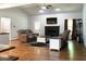 Spacious living room features a stone fireplace, hardwood floors, ceiling fan, and comfortable seating at 154 Carmen Ln, Dallas, GA 30157