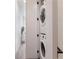 Convenient laundry area with stacked washer and dryer in hallway at 1606 Rock Dam Dr # 11, Atlanta, GA 30317