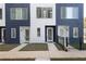 The townhouse features a blue and white facade, a small yard and a modern design at 1606 Rock Dam Dr # 11, Atlanta, GA 30317