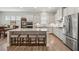 Bright kitchen featuring stainless appliances, granite countertops, and open access to the breakfast area at 3210 Steinbeck St, Cumming, GA 30041