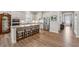 Spacious kitchen with stainless steel appliances, granite countertops, and breakfast bar seating at 3210 Steinbeck St, Cumming, GA 30041