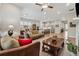 Open-concept living space with a large kitchen island, dining area, and cozy living room at 3210 Steinbeck St, Cumming, GA 30041
