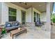Covered patio with comfortable seating, perfect for outdoor relaxation and enjoying nature at 3210 Steinbeck St, Cumming, GA 30041