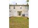Backyard featuring a privacy fence, grassy area, and patio for outdoor living and entertaining at 3216 Panthers Trce, Decatur, GA 30034