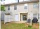 Backyard with a patio, grassy area, and privacy fence, perfect for relaxation and outdoor activities at 3216 Panthers Trce, Decatur, GA 30034