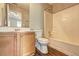 Bathroom with double vanity, a tub with shower, and laminate flooring at 3216 Panthers Trce, Decatur, GA 30034