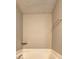 Bathroom showcasing a soaking tub, neutral walls, and laminate floors at 3216 Panthers Trce, Decatur, GA 30034