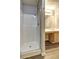 Bathroom showcasing a shower, vanity with a cabinet, and wood-look flooring at 3216 Panthers Trce, Decatur, GA 30034