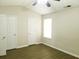 Bedroom with two closets, window, and wood-look flooring at 3216 Panthers Trce, Decatur, GA 30034
