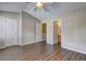 Spacious bedroom featuring laminate floors, neutral walls, and ensuite bathroom at 3216 Panthers Trce, Decatur, GA 30034