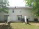 Exterior of the rear of the home, showcasing the fenced yard and patio area at 3216 Panthers Trce, Decatur, GA 30034