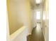 Hallway with wood flooring, closets, and white walls at 3216 Panthers Trce, Decatur, GA 30034