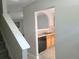 Open kitchen view shows dishwasher, arch pass-through, and tiled floor at 3216 Panthers Trce, Decatur, GA 30034
