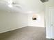 Spacious living room featuring modern flooring and an arched window to the kitchen at 3216 Panthers Trce, Decatur, GA 30034