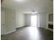 Open-concept living room featuring modern flooring, fireplace, and sliding glass door at 3216 Panthers Trce, Decatur, GA 30034