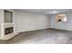 Cozy living room features fireplace, wood-look floors and arched opening to the kitchen at 3216 Panthers Trce, Decatur, GA 30034
