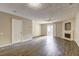 Spacious living room featuring wood floors, a fireplace, a ceiling fan, and sliding glass doors at 3216 Panthers Trce, Decatur, GA 30034