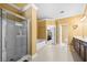 Bright bathroom with a glass-enclosed shower, soaking tub, and double vanity at 5015 Scuppernong Ct, Austell, GA 30106