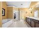 Luxurious bathroom with a soaking tub, dual vanities, and access to a walk-in closet at 5015 Scuppernong Ct, Austell, GA 30106