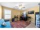 Bedroom with a futon, electric drum set, aquarium, ceiling fan and a window at 5015 Scuppernong Ct, Austell, GA 30106