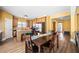 Open concept kitchen featuring hardwood floors, stainless steel appliances, and bar stool seating at 5015 Scuppernong Ct, Austell, GA 30106