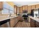 Well-equipped kitchen featuring stainless steel appliances, ample counter space, and stainless steel sink at 5015 Scuppernong Ct, Austell, GA 30106