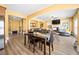 Open concept living room featuring hardwood floors and seamlessly flowing to the dining and kitchen area at 5015 Scuppernong Ct, Austell, GA 30106