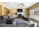 Cozy living room with a fireplace, large windows, and a comfortable sectional sofa at 5015 Scuppernong Ct, Austell, GA 30106