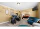 Comfortable home office or reading room with cozy seating and an open view to the main bedroom at 5015 Scuppernong Ct, Austell, GA 30106
