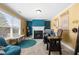 Inviting home office with bright accents, built-in fireplace, and tranquil window views at 5015 Scuppernong Ct, Austell, GA 30106