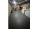 Finished basement area featuring exercise equipment and extra freezers, adding functionality at 7491 Hilltop Way, Atlanta, GA 30349