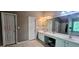 Large bathroom with double sinks, vanity, and white cabinets, offers both tub and shower at 7491 Hilltop Way, Atlanta, GA 30349