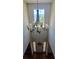 Bright foyer with high ceilings, hardwood floors, decorative chandelier, and a glimpse of the front entrance at 7491 Hilltop Way, Atlanta, GA 30349