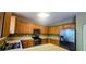 Modern kitchen with stainless steel appliances, wooden cabinets, tiled backsplash, and ample counter space at 7491 Hilltop Way, Atlanta, GA 30349