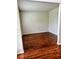 Open-concept living room with hardwood floors and natural light at 7491 Hilltop Way, Atlanta, GA 30349