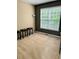 Comfortable living room area with plush carpeting and a bright window at 7491 Hilltop Way, Atlanta, GA 30349