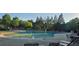 Outdoor community pool with lounge chairs for relaxation and recreation at 7491 Hilltop Way, Atlanta, GA 30349