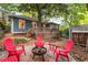 Spacious backyard with wooden deck, mature trees, outdoor seating area, and wooden storage shed at 165 Hale Ne St, Atlanta, GA 30307