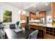 Dining area adjacent to kitchen with stainless appliances, granite countertops and breakfast bar at 165 Hale Ne St, Atlanta, GA 30307