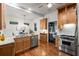 Open-concept kitchen with stainless appliances, a gas range, granite countertops, and hardwood floors at 165 Hale Ne St, Atlanta, GA 30307