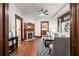 Living room featuring wood trim, a fireplace, hardwood floors, and an open layout at 165 Hale Ne St, Atlanta, GA 30307