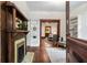 Cozy living room with hardwood floors, a fireplace, and an open doorway to the kitchen at 165 Hale Ne St, Atlanta, GA 30307