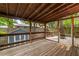 Spacious screened in porch area with wooden deck and view of backyard at 165 Hale Ne St, Atlanta, GA 30307