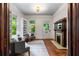 Sitting room features built-in bookshelves, wood floors, and windows showcasing the outdoors at 165 Hale Ne St, Atlanta, GA 30307